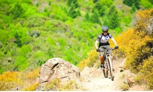 cyclist riding through the mountains